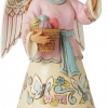 Angel figurine with Easter basket and butterflies