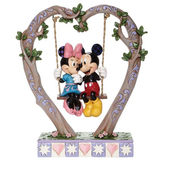 Mickey and Minnie Mouse figurine in the cradle